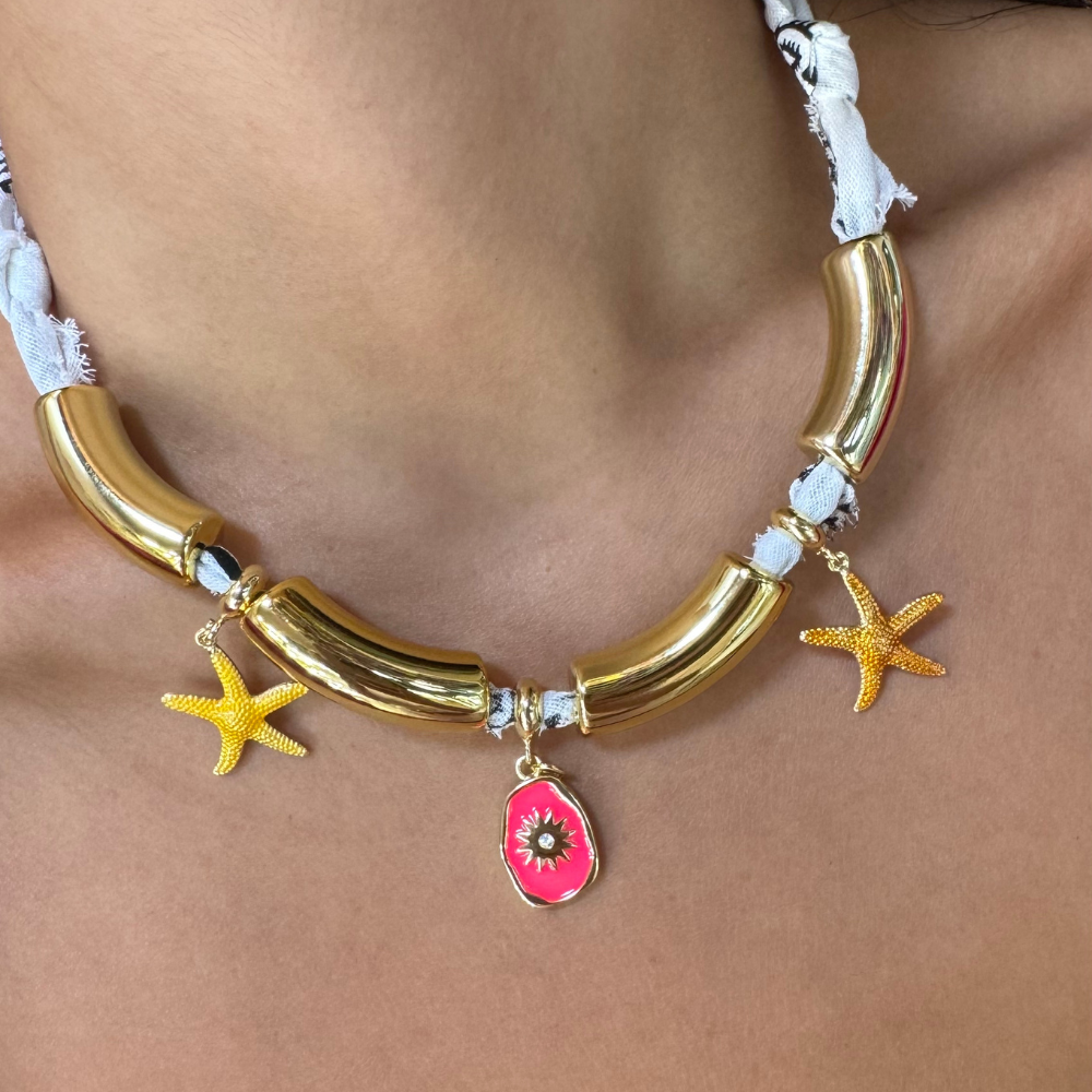 Handmade white bandana choker featuring polished gold tube segments and starfish charms.