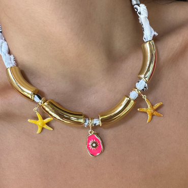 Handmade white bandana choker featuring polished gold tube segments and starfish charms.