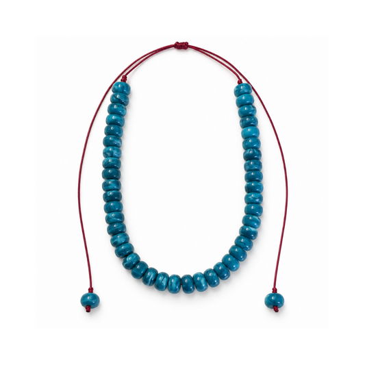Blue 12 mm acrylic bead necklace with an adjustable bordeaux cord and one matching bead at each end, photographed on white.