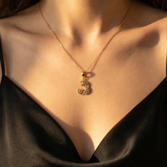 woman wearing colorful crab pendant necklace gold summer jewelry styling