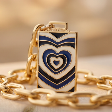 Close-up of blue enamel heart talisman pendant on Élan Link gold necklace
