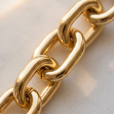 Close-up detail of Élan Link 18K gold plated brass oval chain bracelet