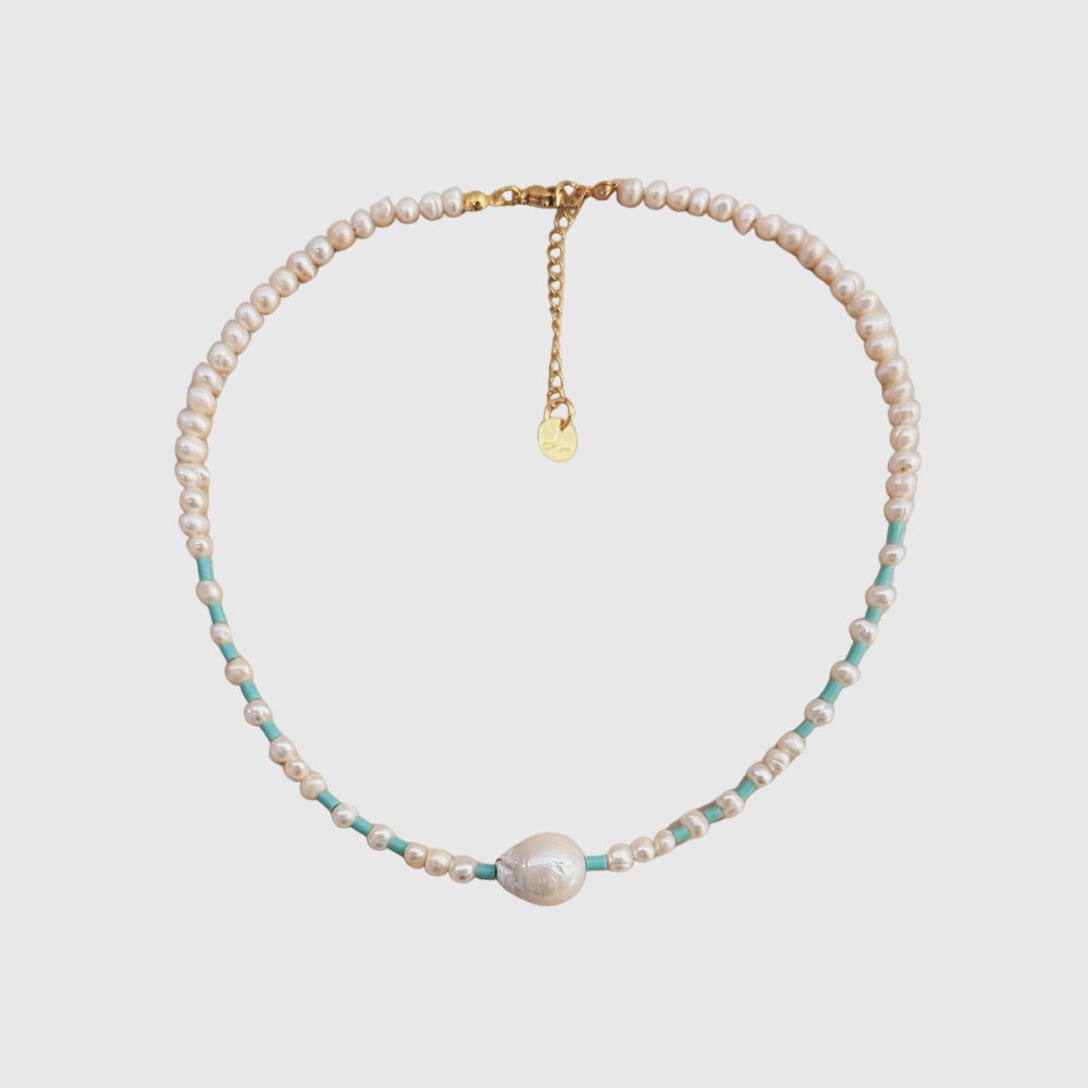 Dainty pearl choker featuring baroque center and turquoise accents with lobster clasp