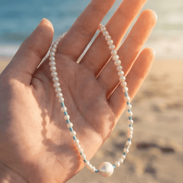 freshwater pearl turquoise necklace in hand beach lifestyle summer jewelry Julie Saldivia