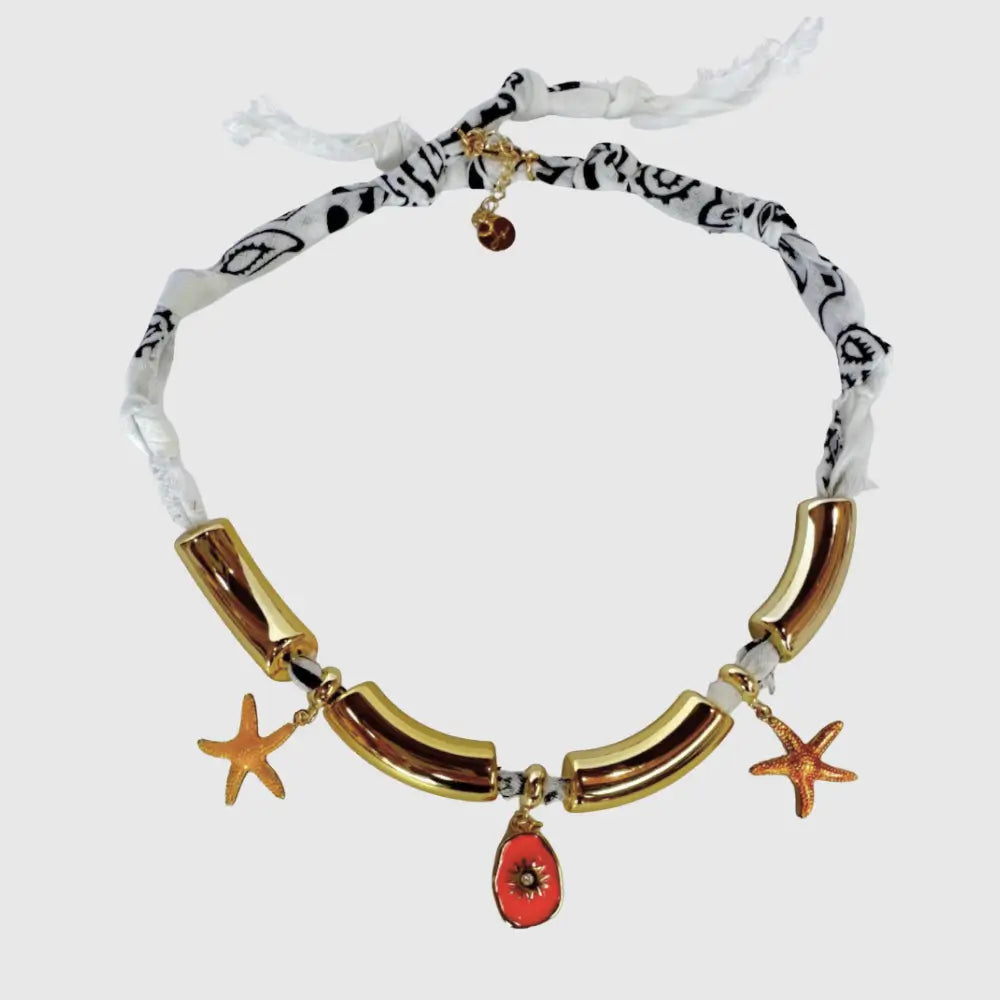 Handmade white bandana choker featuring polished gold tube segments and starfish charms