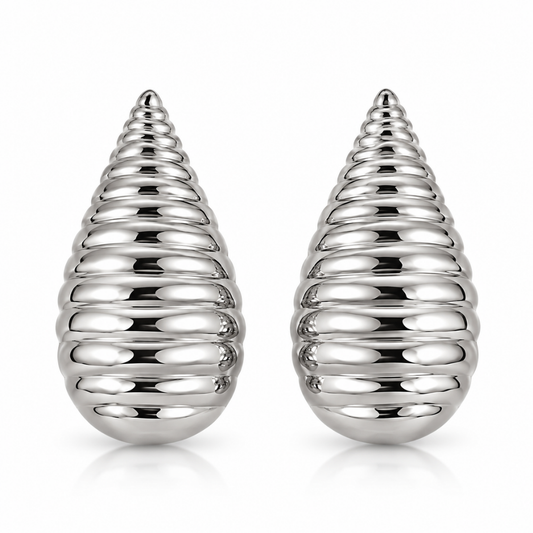 Pair of polished silver-tone cocoon earrings with elongated teardrop silhouettes and rounded horizontal ridges on a white background.