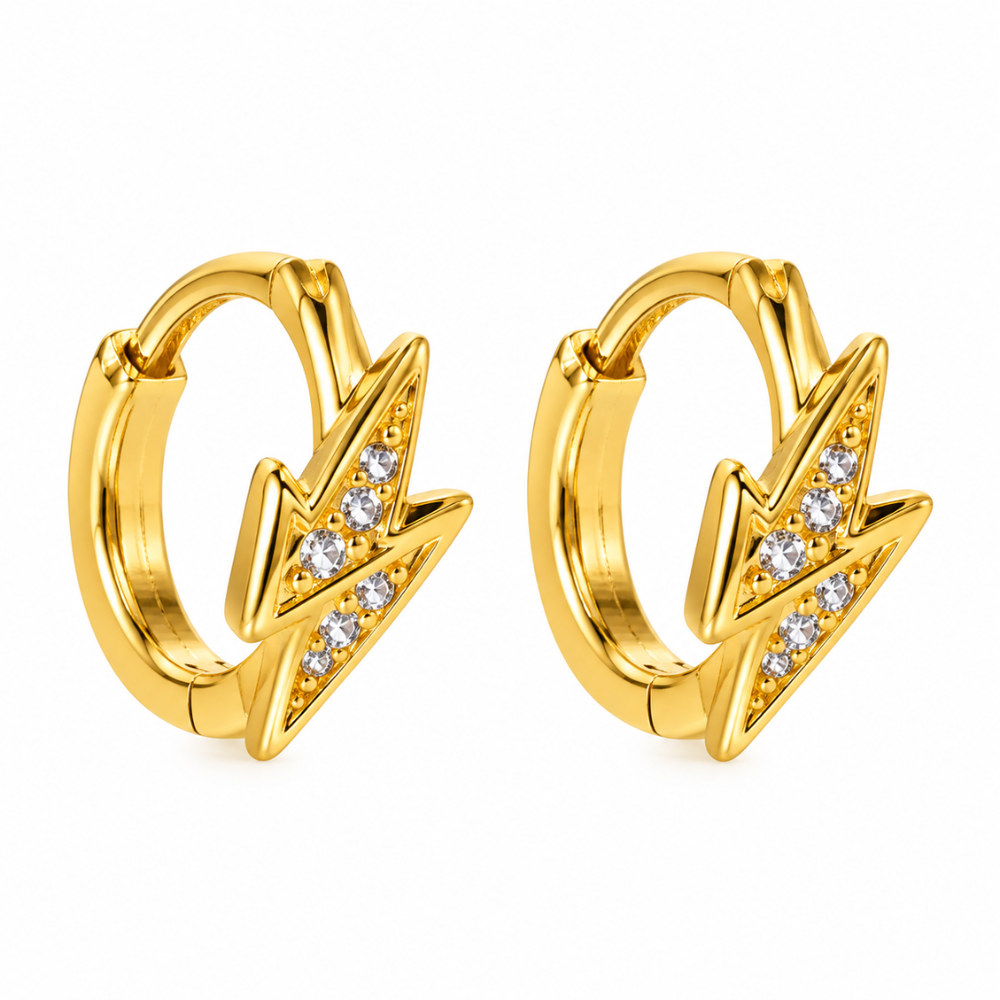 Gold-tone stainless steel lightning bolt huggie earrings with clear crystal accents, lightweight design by Julie Saldivia.
