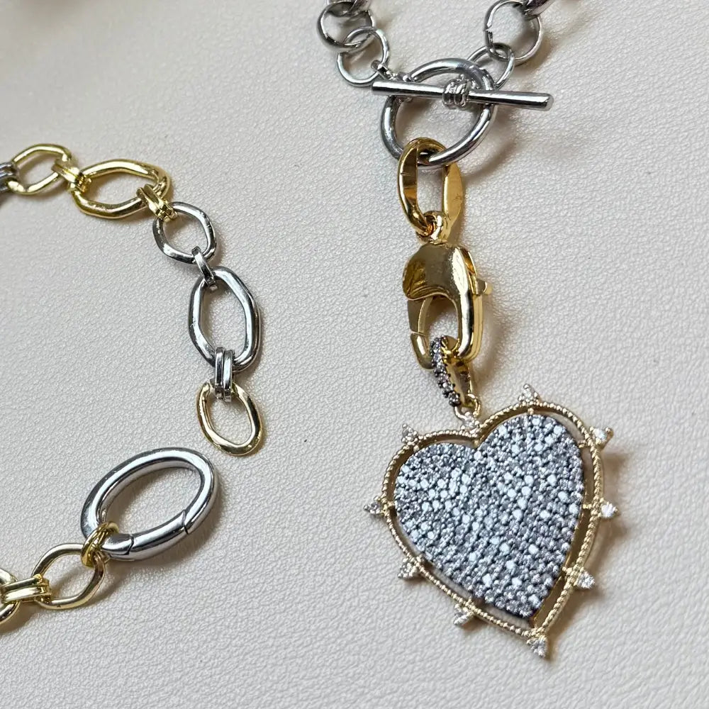 Mixed-metal toggle necklace with light blue pavé heart charm on silver chain