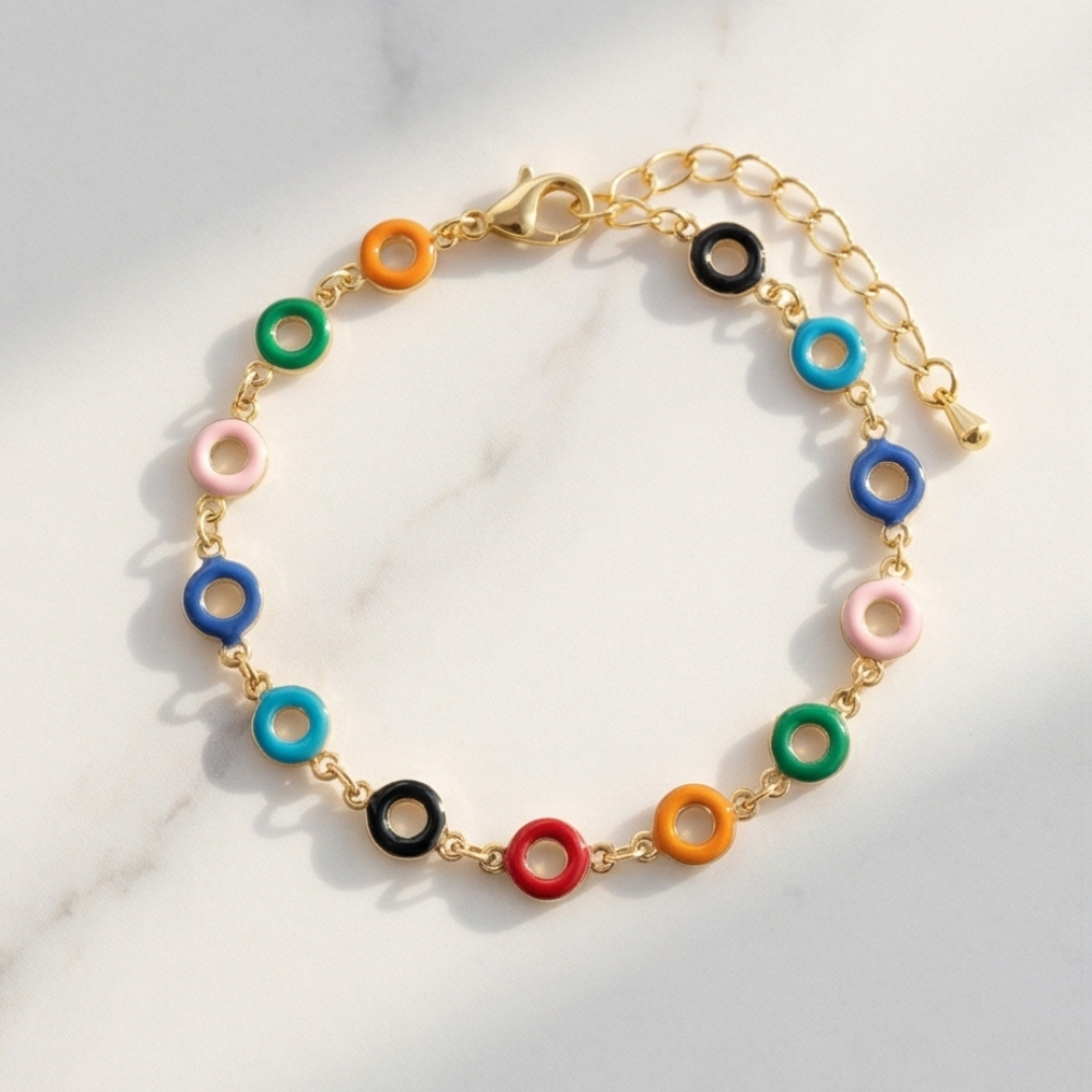 Colorful bracelet with gold chain on a light background