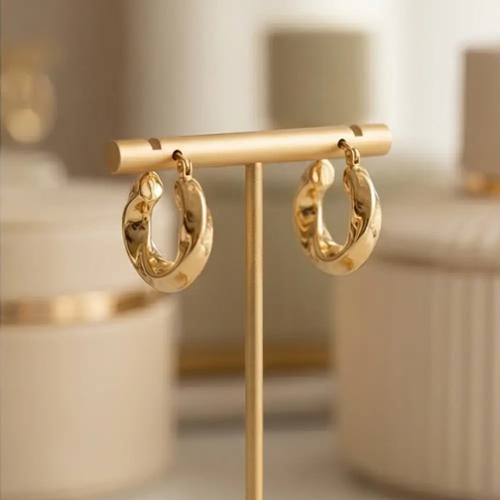 18k gold plated huggie hoop earrings on stand elegant lightweight gold hoops for women