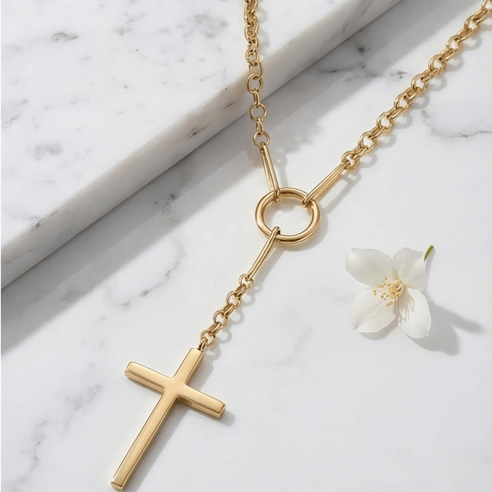Gold cross Y necklace with circular connector and minimalist lariat design in polished gold finish