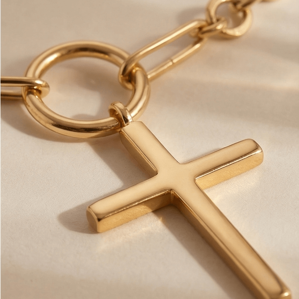 Gold cross Y necklace with circular connector and minimalist lariat design in polished gold finish