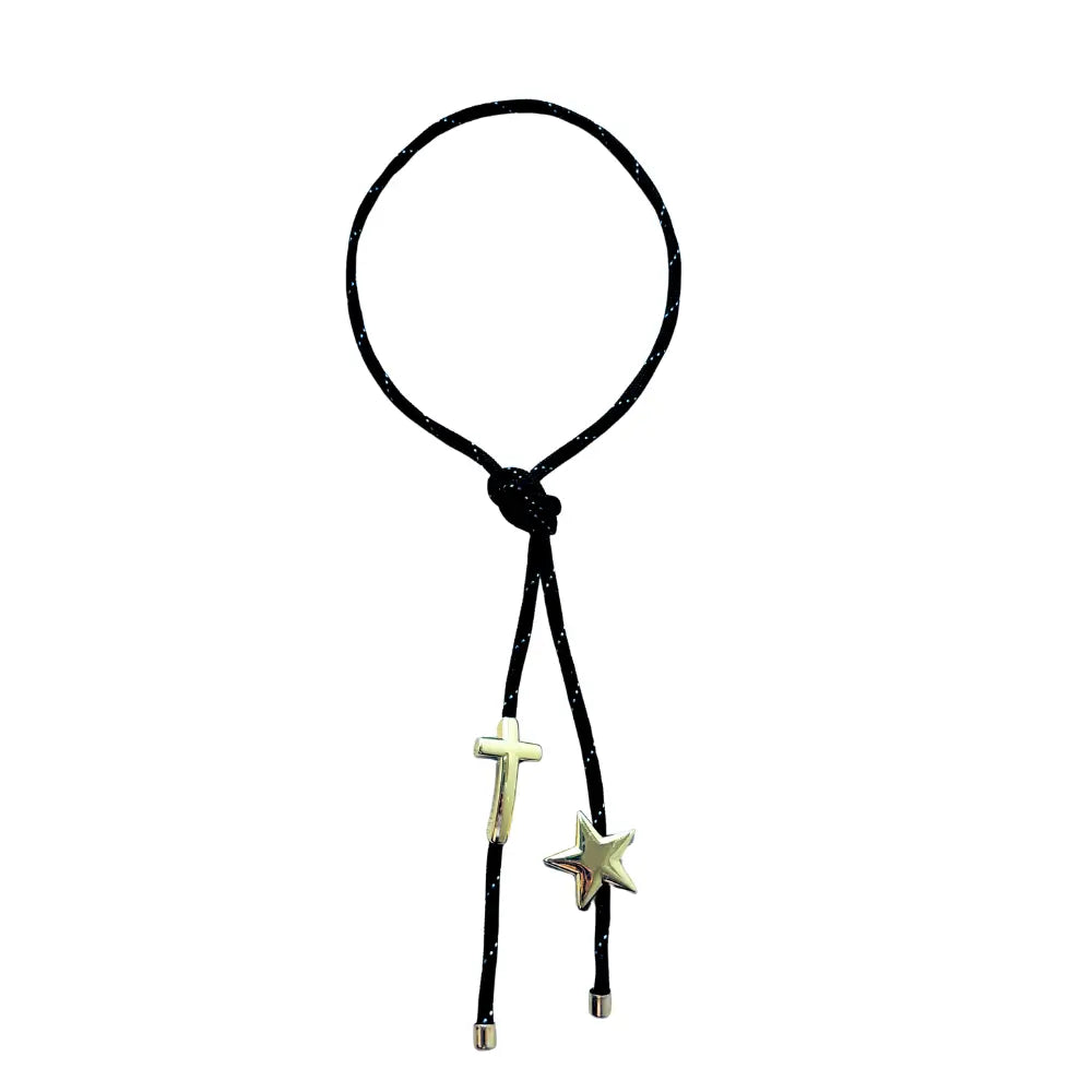 Black paracord wrap necklace designed to tie around the neck, featuring magnetic star and cross charms in 18K gold plating by Julie Saldivia