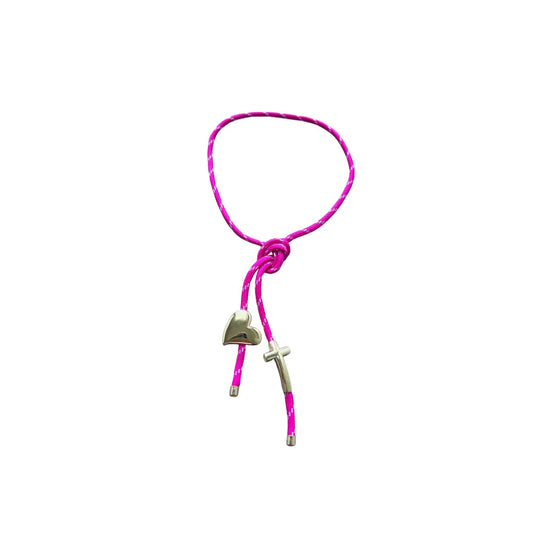 Pink paracord wrap necklace designed to tie around the neck, featuring magnetic heart and cross charms in 18K gold plating by Julie Saldivia