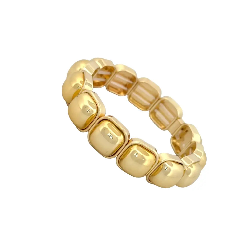 Two tone gold and silver stretch bracelet worn by model holding clutch – modern elastic statement bracelet for women