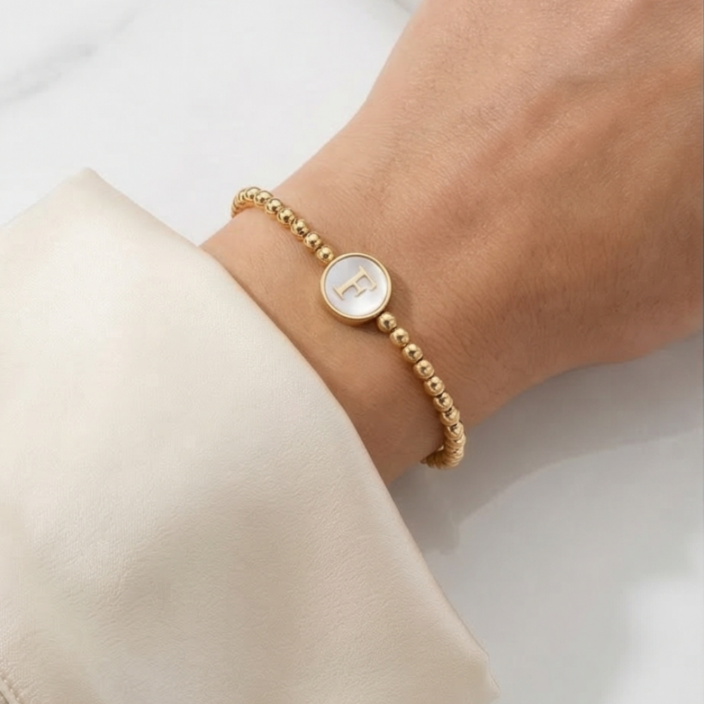 Adjustable 18K gold plated initial F bracelet with mother of pearl charm and delicate gold beaded chain