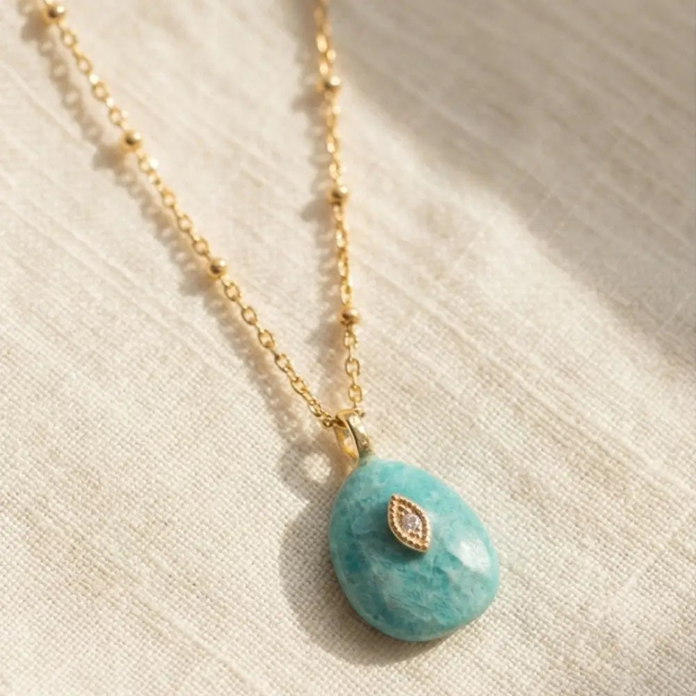 Amazonite stone pendant necklace with gold evil eye detail on delicate chain
