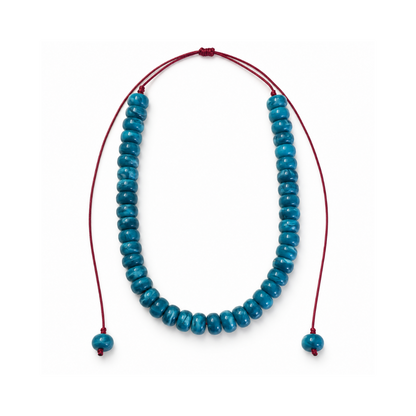 Blue 12 mm acrylic bead necklace with an adjustable bordeaux cord and one matching bead at each end, photographed on white.