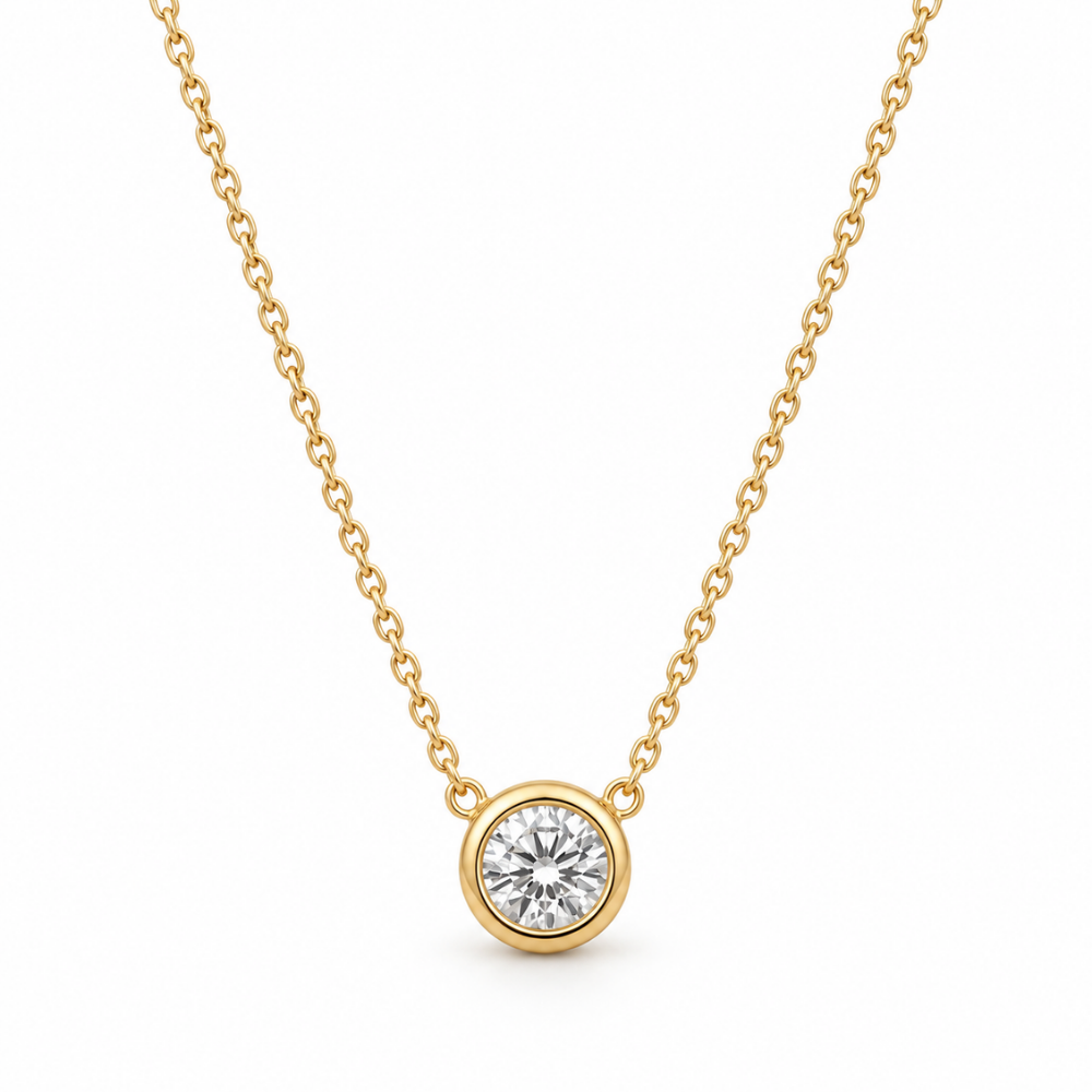 Clara Round Bezel Necklace in gold-plated sterling silver 925, featuring a sparkling clear round faceted stone in a polished gold bezel setting.
