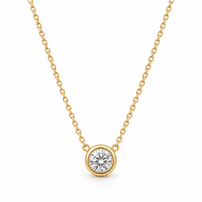 Clara Round Bezel Necklace in gold-plated sterling silver 925, featuring a sparkling clear round faceted stone in a polished gold bezel setting.