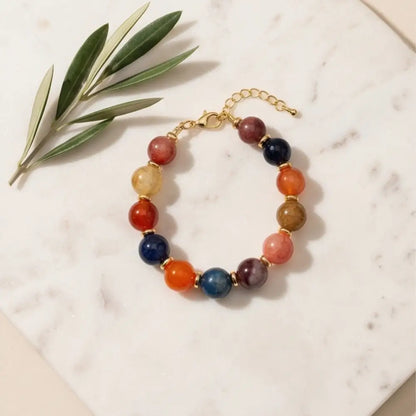 colorful-gemstone-bracelet-gold-clasp-flatlay-natural-light