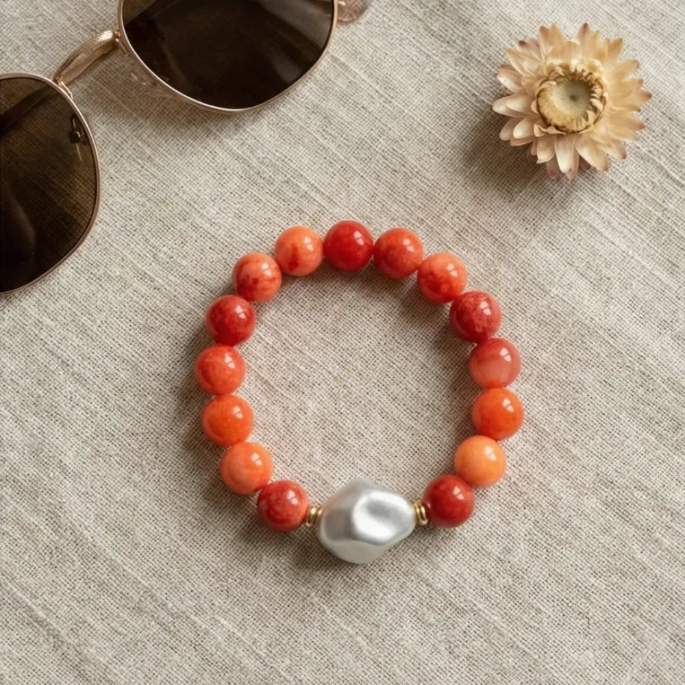 Coral and pearl bracelet flat lay boho chic jewelry styling