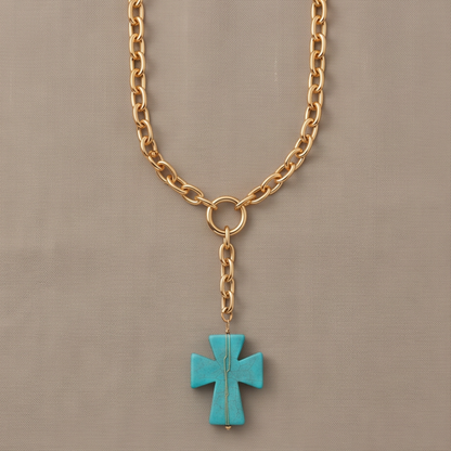 Élan Link 24-inch gold Y necklace with circular clasp and turquoise cross pendant