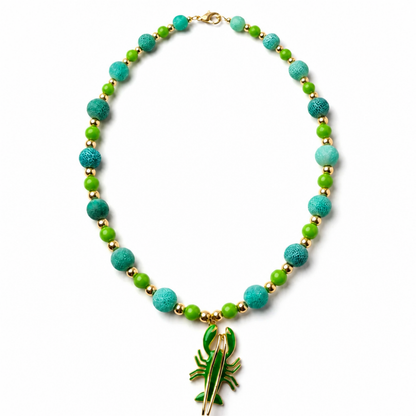 Emerald Lobster necklace with 12 mm natural green fire-cracked agate beads, bright green accents, gold-tone spacers and green lobster pendant