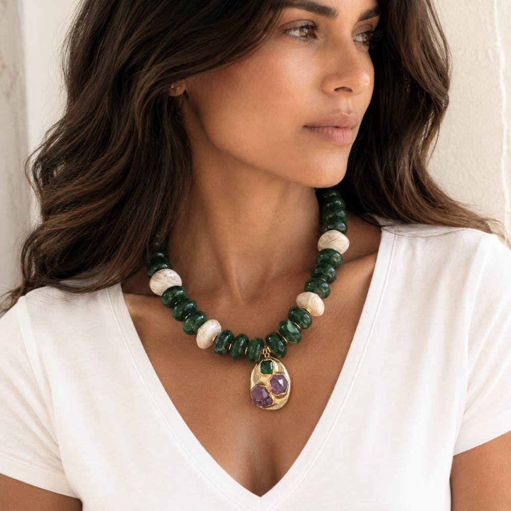 Woman wearing Emerald Relic green and off-white statement necklace styled with a simple fall outfit