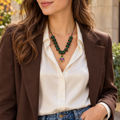 Woman wearing the Emerald Relics Cord Necklace with a white shirt, brown blazer and jeans.