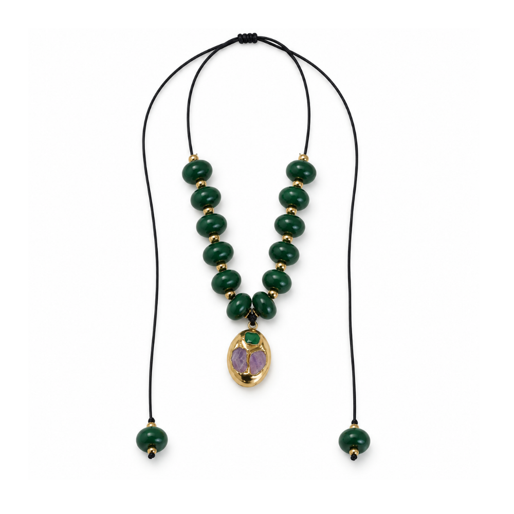 Emerald-green acrylic bead necklace on an adjustable black cord with a brass pendant and green beaded ends.