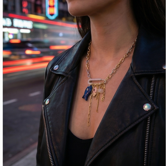 evil eye hamsa charm necklace gold chain city background lifestyle jewelry