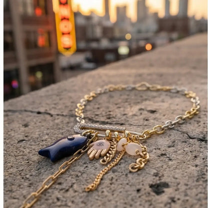 evil eye hamsa lapis charm necklace gold chain street style woman leather jacket night city