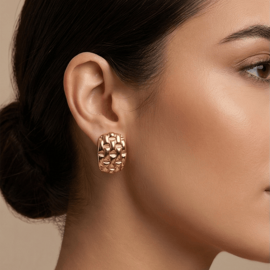 gold chunky textured stud earrings on woman bold elegant everyday luxury jewelry