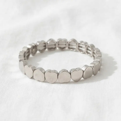 Gold or silver heart stretch bracelet for women, elastic beaded bracelet with minimalist heart charms.