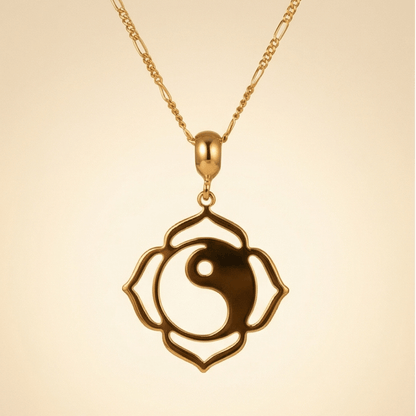 gold yin yang lotus necklace flat lay with crystal and matcha minimalist jewelry aesthetic
