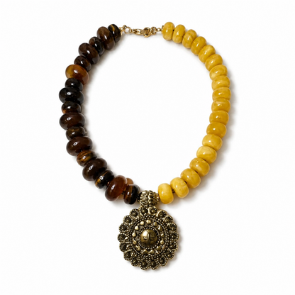 Golden Earth statement necklace with brown and mustard acrylic beads and antique gold-tone medallion pendant