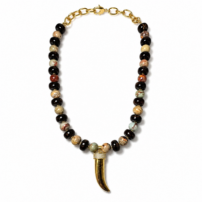 Black and multicolor beaded necklace with gold-tone chain, clasp and gold tusk pendant
