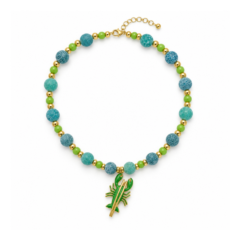 18-inch natural fire-cracked agate necklace with green accent beads, gold-tone spacers and a green lobster charm.