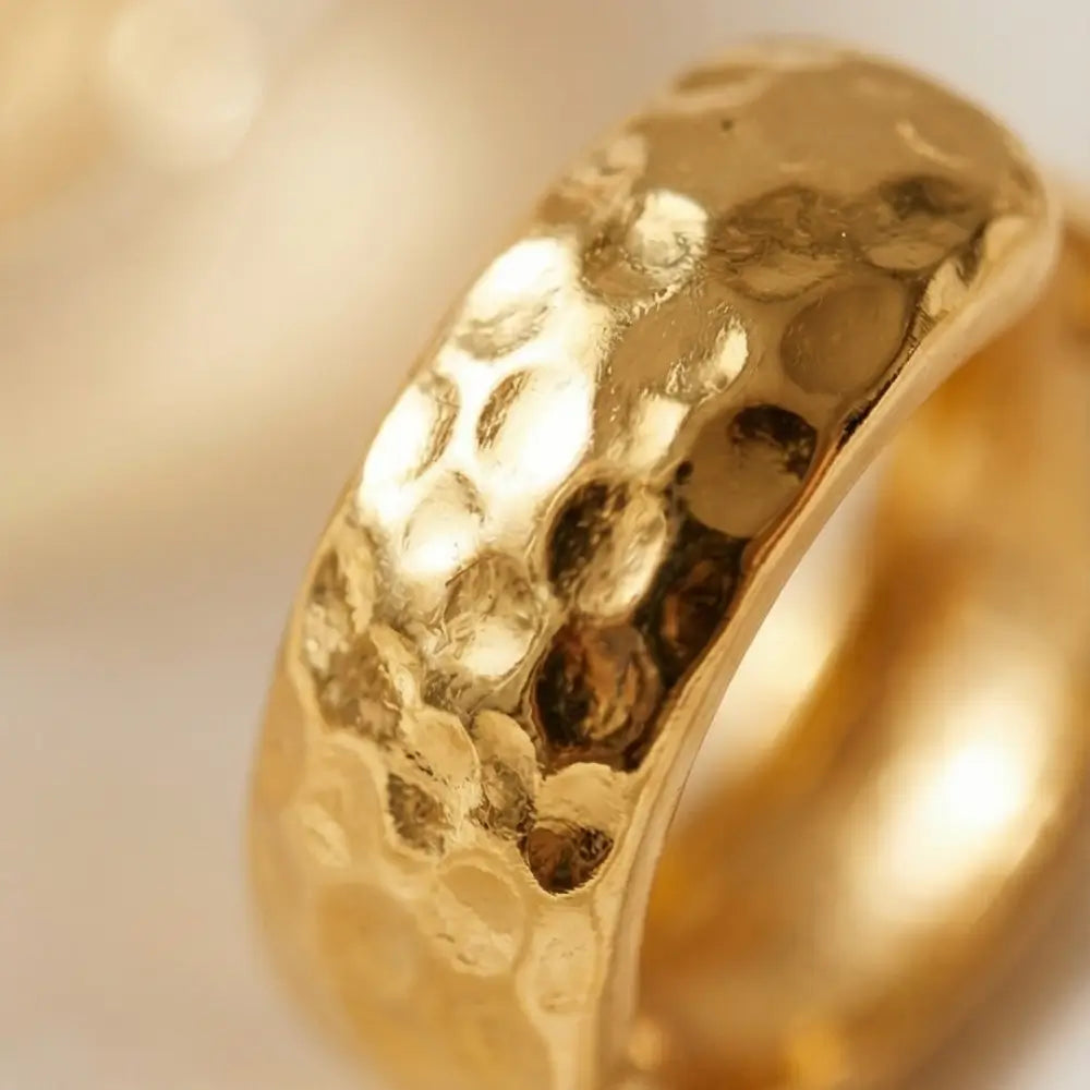 close up hammered gold hoop earrings textured finish luxury jewelry