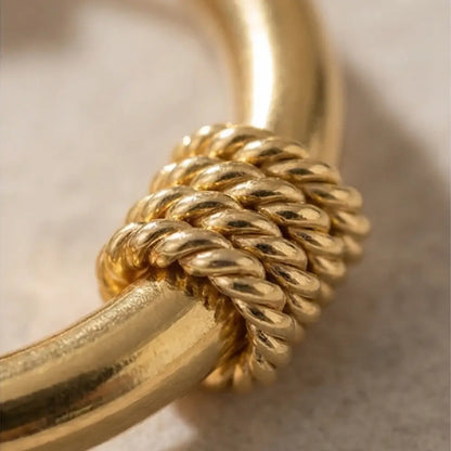 close up gold hoop earrings with twisted rope texture detail high shine 18k gold plated jewelry