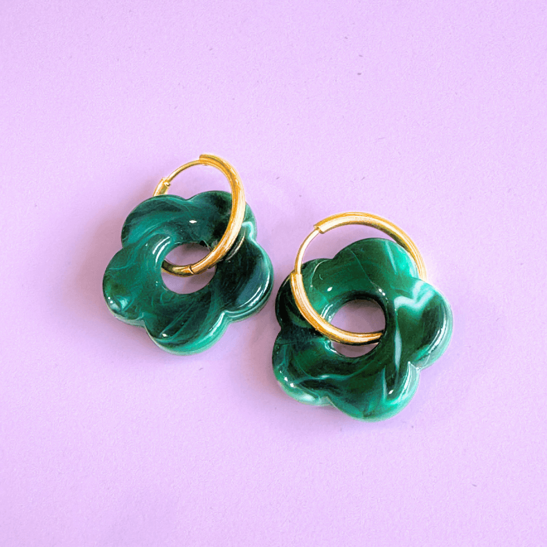 - Floral huggie earrings - Colorful stainless steel huggies - Lightweight flower huggies - Modern floral huggie hoops - Hypoallergenic earrings - Fashion statement jewelry - Unique flower huggies - Everyday elegant earrings