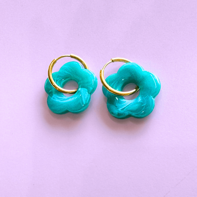 - Floral huggie earrings - Colorful stainless steel huggies - Lightweight flower huggies - Modern floral huggie hoops - Hypoallergenic earrings - Fashion statement jewelry - Unique flower huggies - Everyday elegant earrings