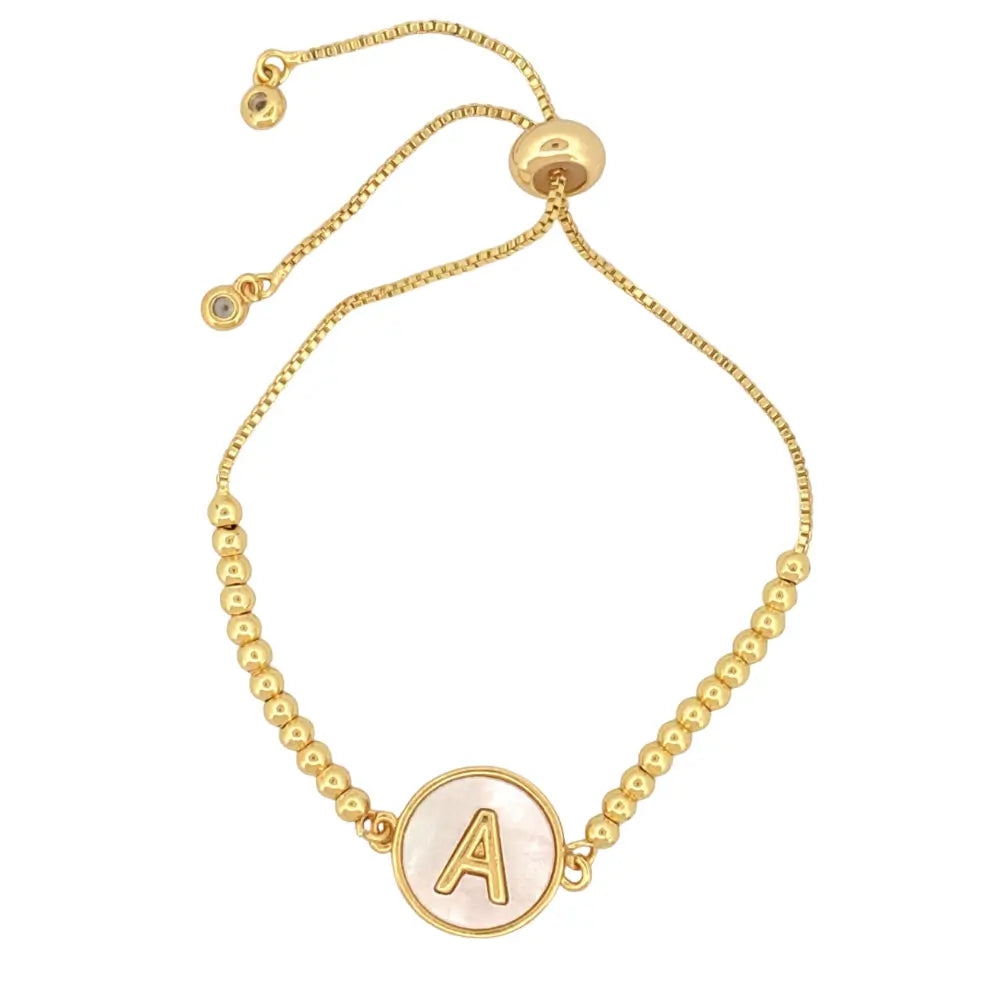 Adjustable gold mother of pearl initial bracelet with sliding clasp and personalized letter charm