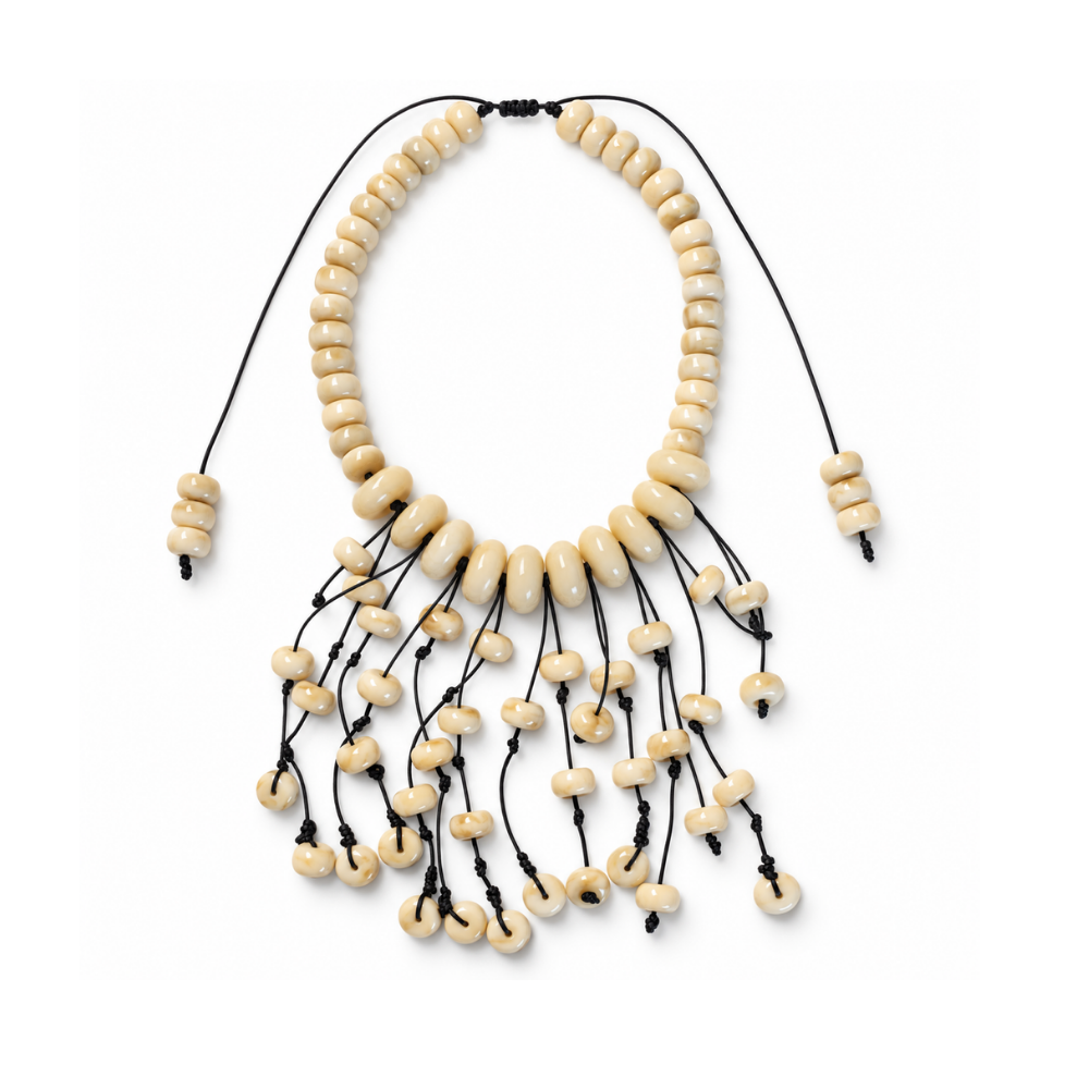 Handwoven macramé necklace with marbled beige acrylic beads, black cords and cascading beaded fringe on a white background.
