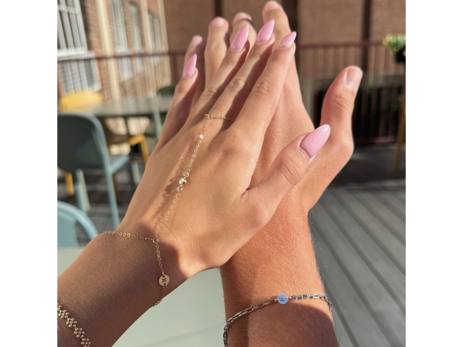 Permanent jewelry bracelets worn by two clients at Julie Saldivia Co.