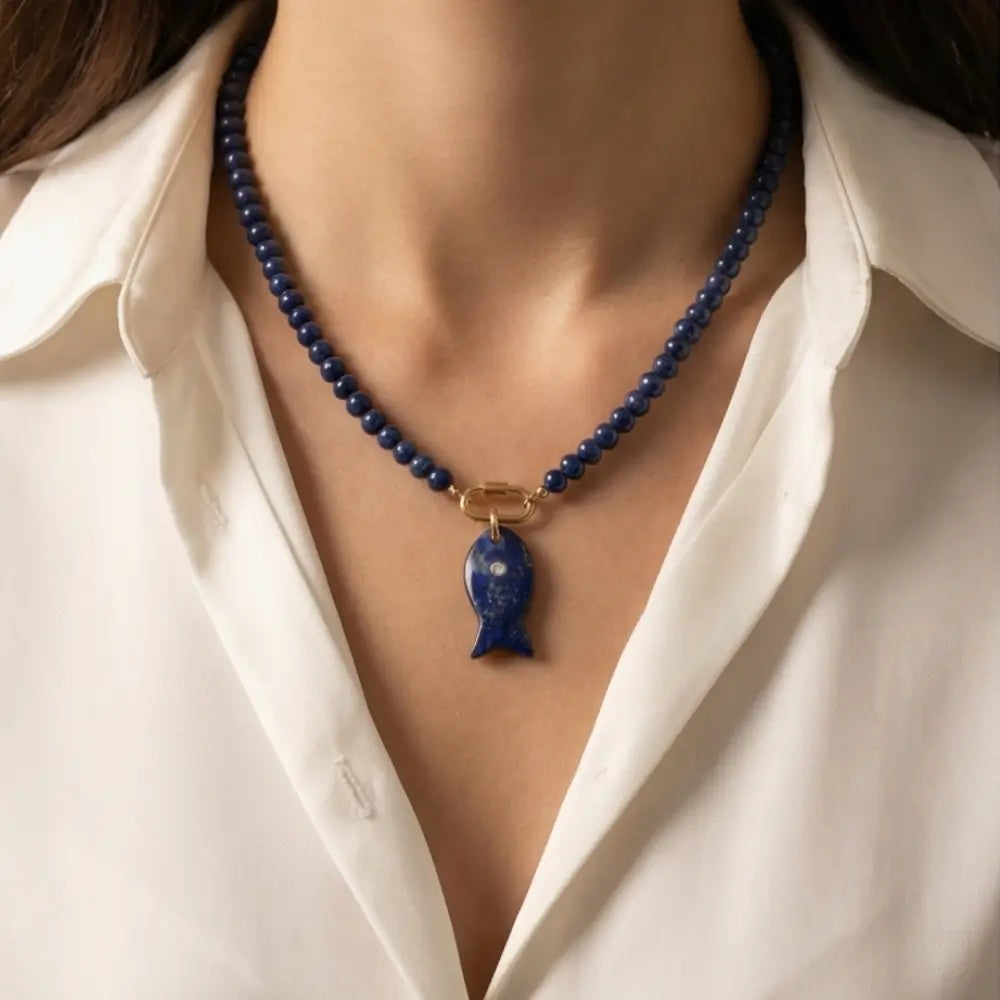 lapis lazuli fish pendant necklace worn by woman elegant statement jewelry look