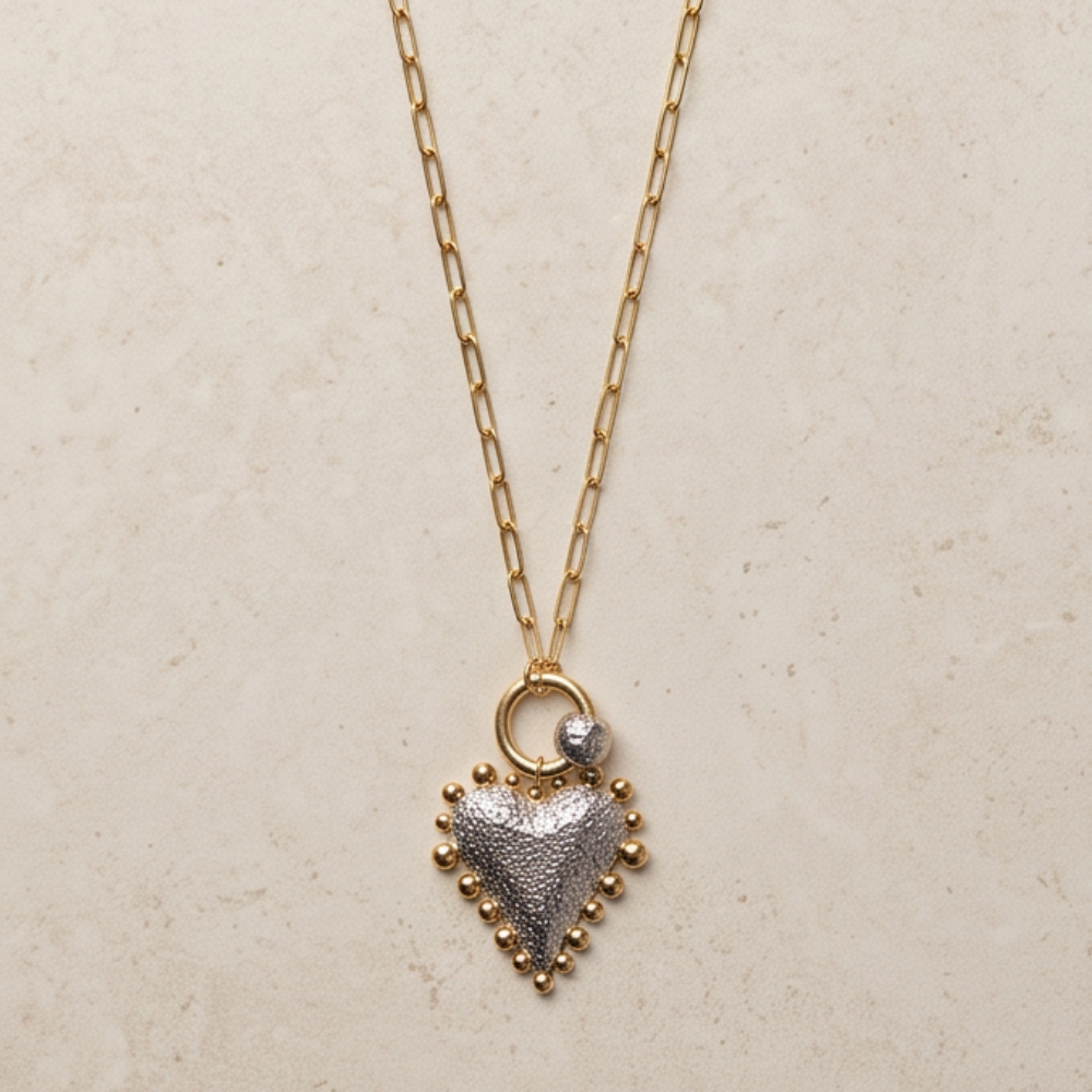 Luna two-tone heart pendant necklace with gold paperclip chain and silver heart pendant