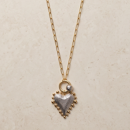 Luna two-tone heart pendant necklace with gold paperclip chain and silver heart pendant