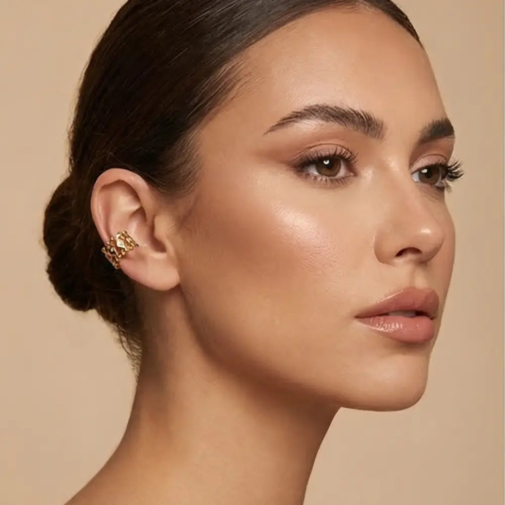 gold statement ear cuff no piercing worn by woman bold modern luxury jewelry Julie Saldivia